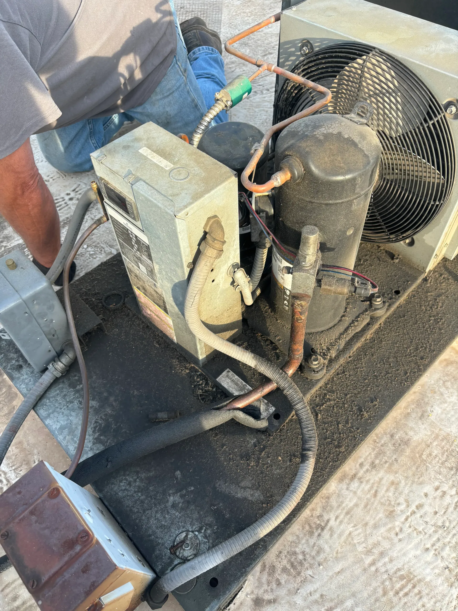 Rooftop refrigeration compressor during change-out work